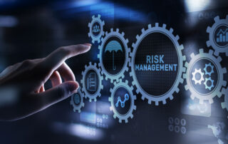 A hand interacting with a digital interface of interlocking gears and a central 'RISK MANAGEMENT' hub, symbolizing proactive risk management strategies for public works in 2026, including icons for insurance protection, data analytics, and team coordination.